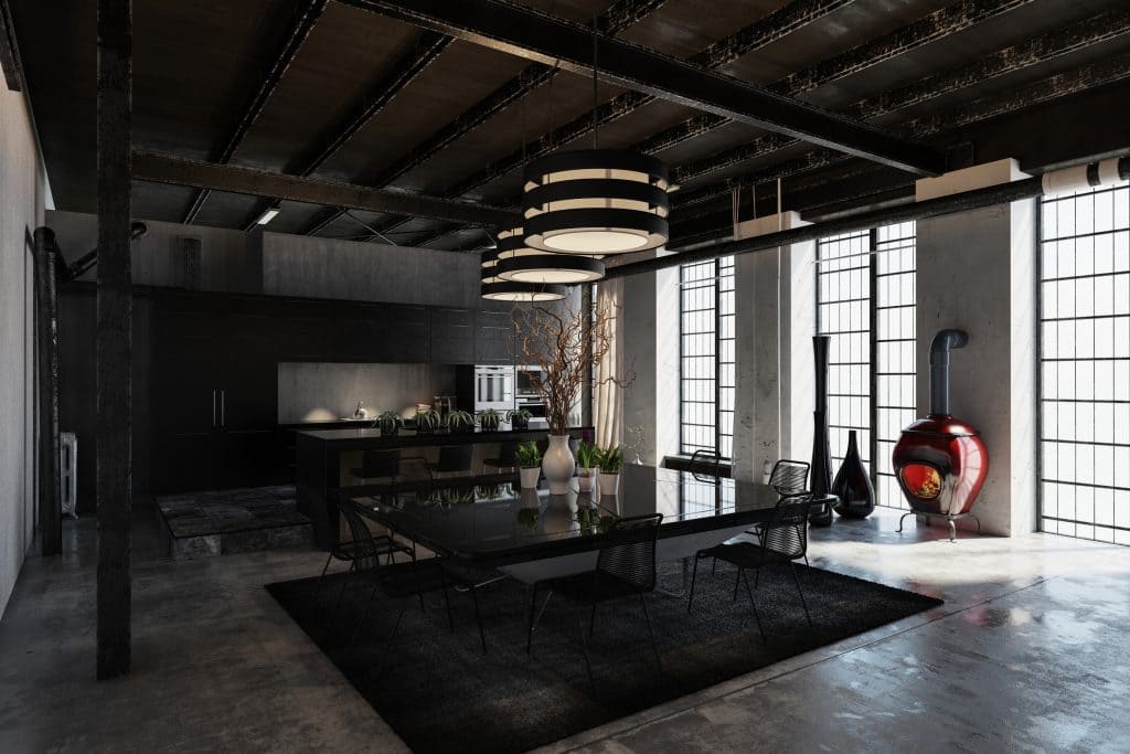 Industrie Loft Esstisch und Küche mit Hochtresen Interior Design Hamburg StudioStern Neubau Industrieloft mit Betonfußboden offener schwarzer Decke Bodenvasen XXL
